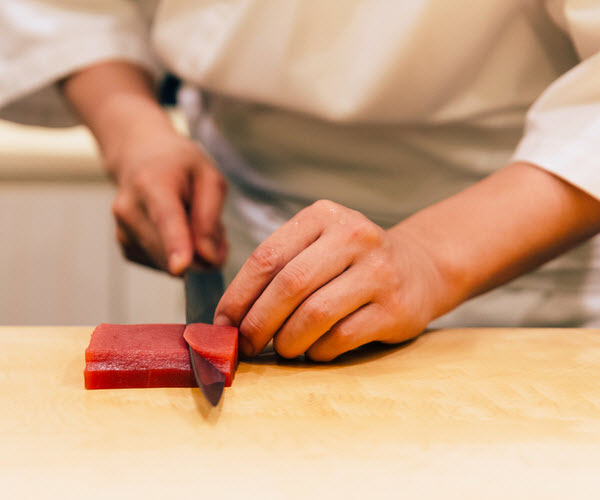 Chef cutting a bluefin tuna
