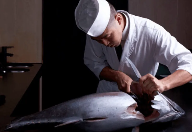 Dinko Tuna - Make a sustainable choice Chief holding big tuna fish