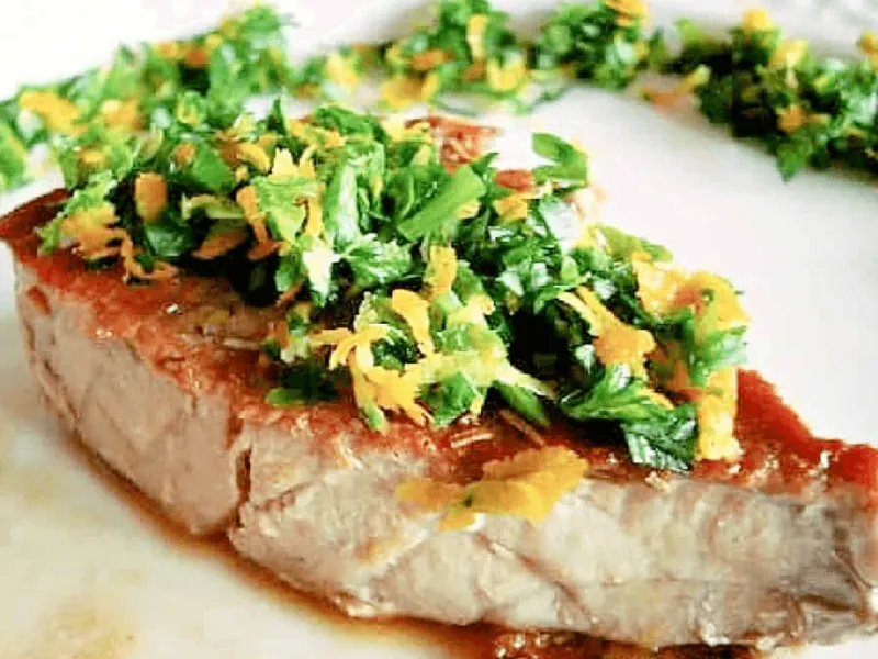 Tuna steak with citrus herb gremolata spooned generously over the top.