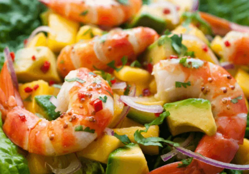 Prawn, mango and avocado salad with red onion and herbs in a bright, fresh mix.