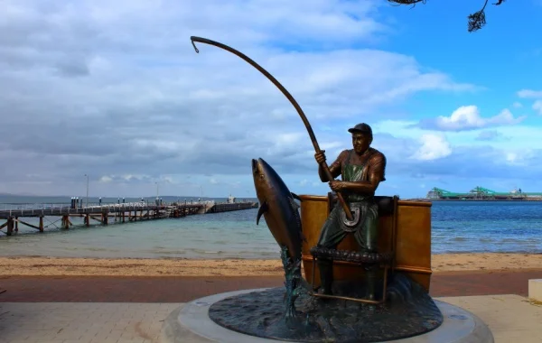 A statue of a man fishing